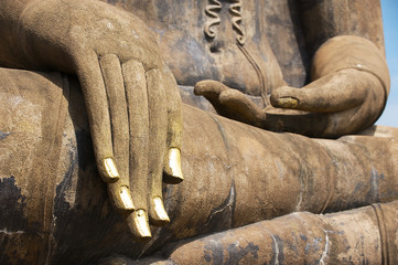 Buddha Statue close up hand detail in Sukhothai, Thailand.