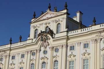 Fototapeta na wymiar Erzbischöfliches Palais (Arcibiskupský palác), barocke Fassade mit Rokoko Verzierungen am Hradschiner Platz, Prag 