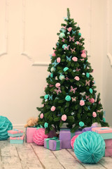 christmas decorated tree and presents tiffany color with pink and paper balls
