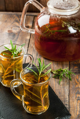 Rosemary tea on  wooden background. Copy space