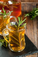 Rosemary tea on  wooden background. Copy space