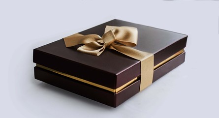 Terra cotta present box with gold ribbon
