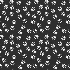 Paw footprint vector dark seamless pattern