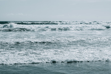 Big surf ocean waves. Blue sea water background