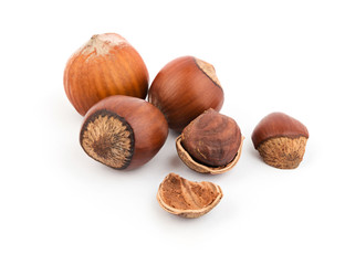 Heap of healthy hazelnuts on white