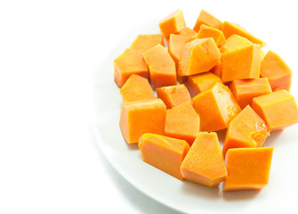 Sweet papaya in dish on white background