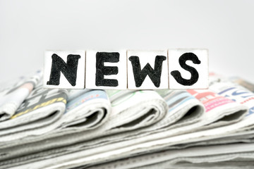 NEWS word on newspaper