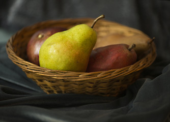 Variety of pears in a wicker basket