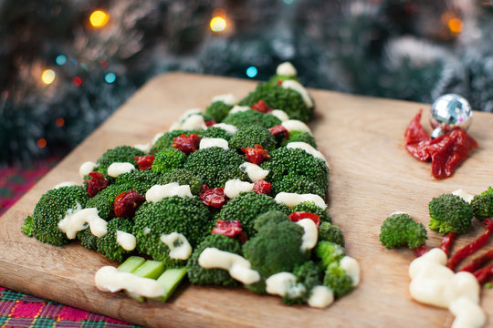 Christmas tree of broccoli green with tomatoes