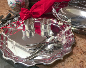 Holiday shiny sterling silver trays and napkin rings