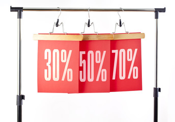 Red paper price labels 30, 50, 70 percent sale off.
