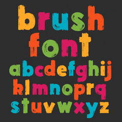 Color lowercase handwritten vector alphabet on black background. Drawn by semi-dry brush with unpainted areas.