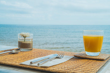 Fototapeta na wymiar Food table at the beach seaview in the morning on vacation day