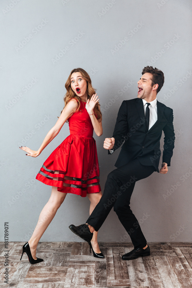 Wall mural Full length portrait of a happy excited couple