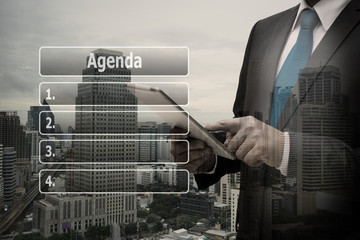 Double exposure businessman hand using digital tablet with virtual panel of agenda list