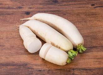 Daikon radish on the wood background