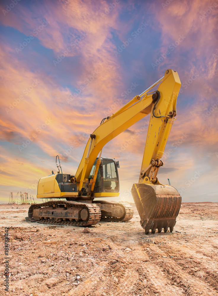 Wall mural heavy earth mover with blue sky in the background