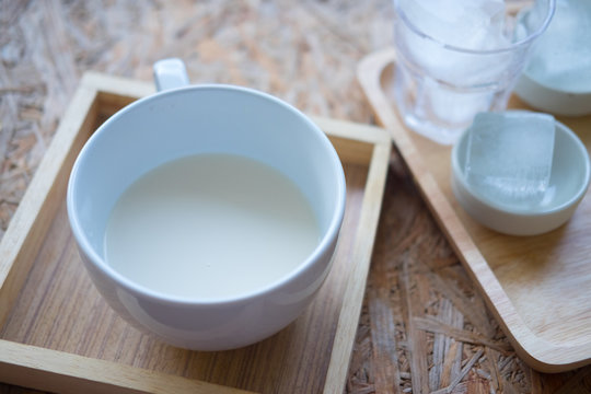A white cup with fresh milk