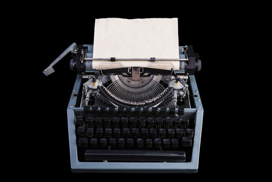 vintage typewriter with paper sheet on black background. Space for your text, mock-up and simulations. Old thing