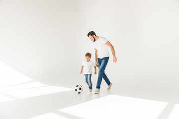 father and son with soccer ball