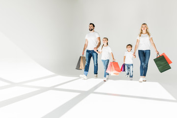 family with shopping bags