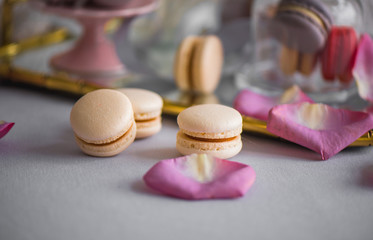 very tasty makarons lie beautifully on a mirror tray, breakfast in bed