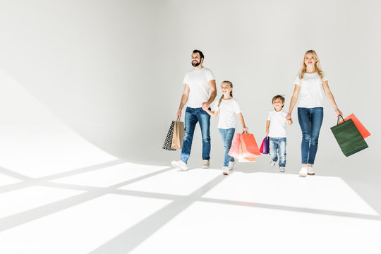 Family With Shopping Bags