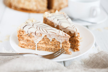 Esterhazy cake sliced on white plate close-up