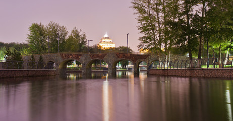 Pedestrian bridge in the central park of Astana in the evening. Kazakhstan