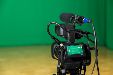 Digital camera in a television Studio. Filming on green screen chroma key.