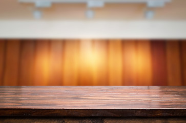 Empty wood table and blurred booked cafe light background. product display template. Business presentation