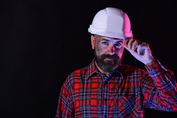 Construction and hard work concept. Worker with brutal image