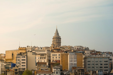 Galata Tower on the hill of buildings, a medieval stone tower in the Galata/Karakoy quarter of Istanbul, Turkey, just to the north of the Golden Horn's junction with the Bosphorus. 