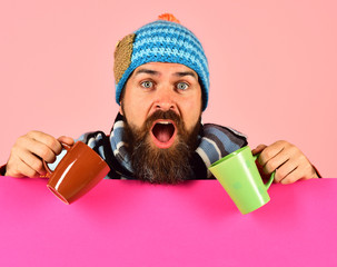 Hipster with beard and shocked face has fragrant coffee
