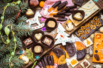 Chocolate candy, citrus fruit, dessert, oranges with Christmas symbols