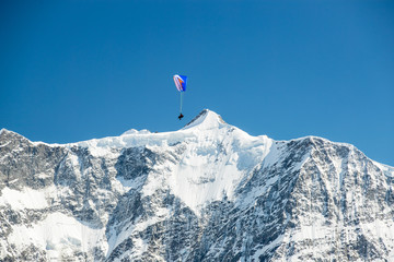 Paraglider over the Swiss Alps