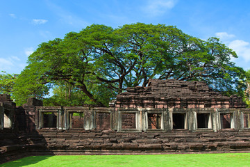 phimai Historical and ancient stone castle in thailand and big tree
