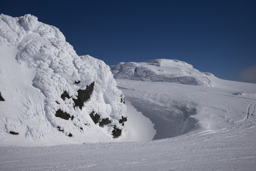 Scenic view of snow covered mountain peak against blue sky, Whistler, British Columbia, Canada