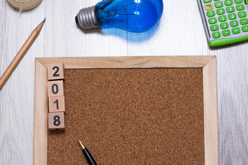 The cork board with official tools and 2018 new years cubes for add text