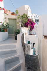 Famous white buildings on of Oia town street in Santorini, Greece