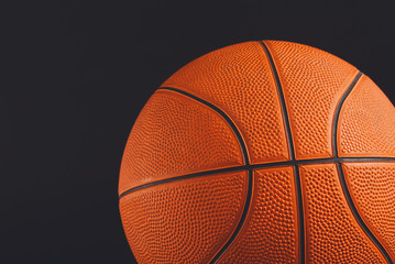 Basketball ball on black background copy space