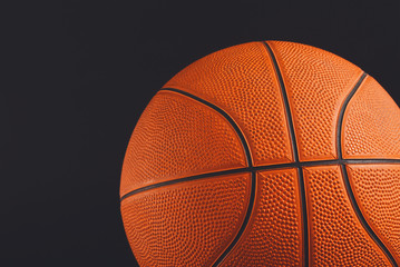 Fototapeta premium Basketball ball on black background copy space