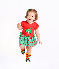 toddler baby in a christmas costume. New Year costume of emotion