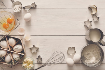 Baking ingredients on rustic white background
