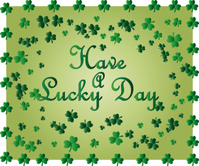 Greeting card of St. Patrick with sparkling green leaves of the clover and place for the text.