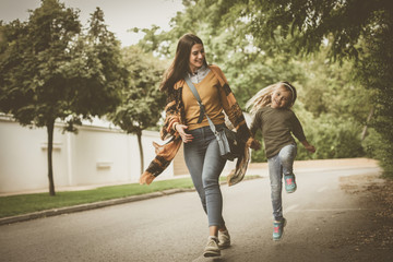 Fototapeta premium Run and jump with Mom at street is fun .
