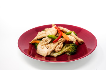 wok fried chicken stir fry with sweet peppers and chinese vegetables