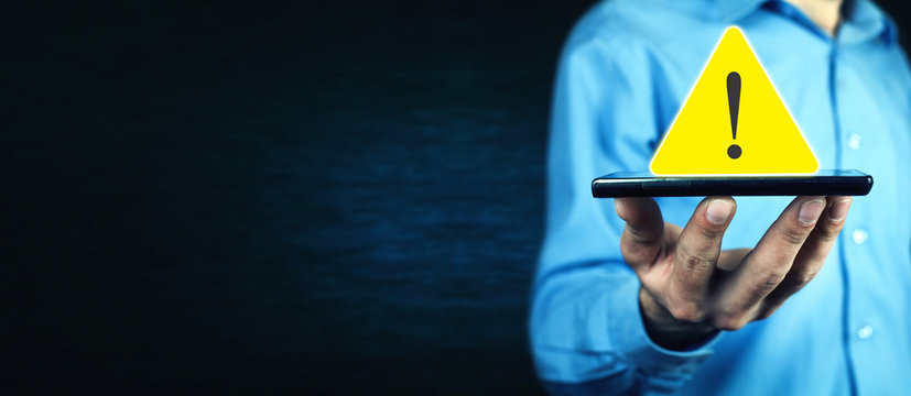 Man holding warning sign.