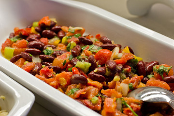 Vegetable salad with red beans and greens