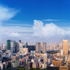 Fototapeta na wymiar Aerial skyscraper view of office building and downtown and cityscapes of Tokyo city with blue sly and clouds background. Japan, Asia